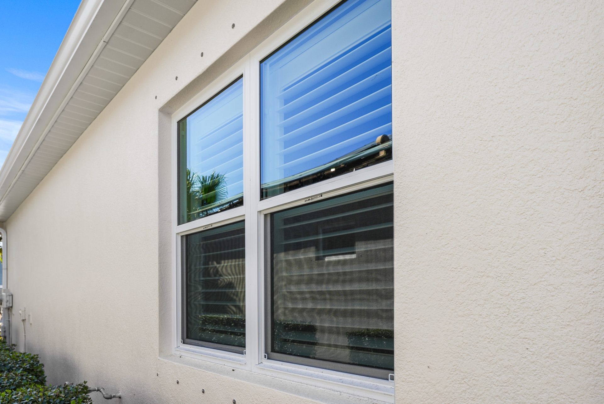 Side elevation showing freshly installed impact windows