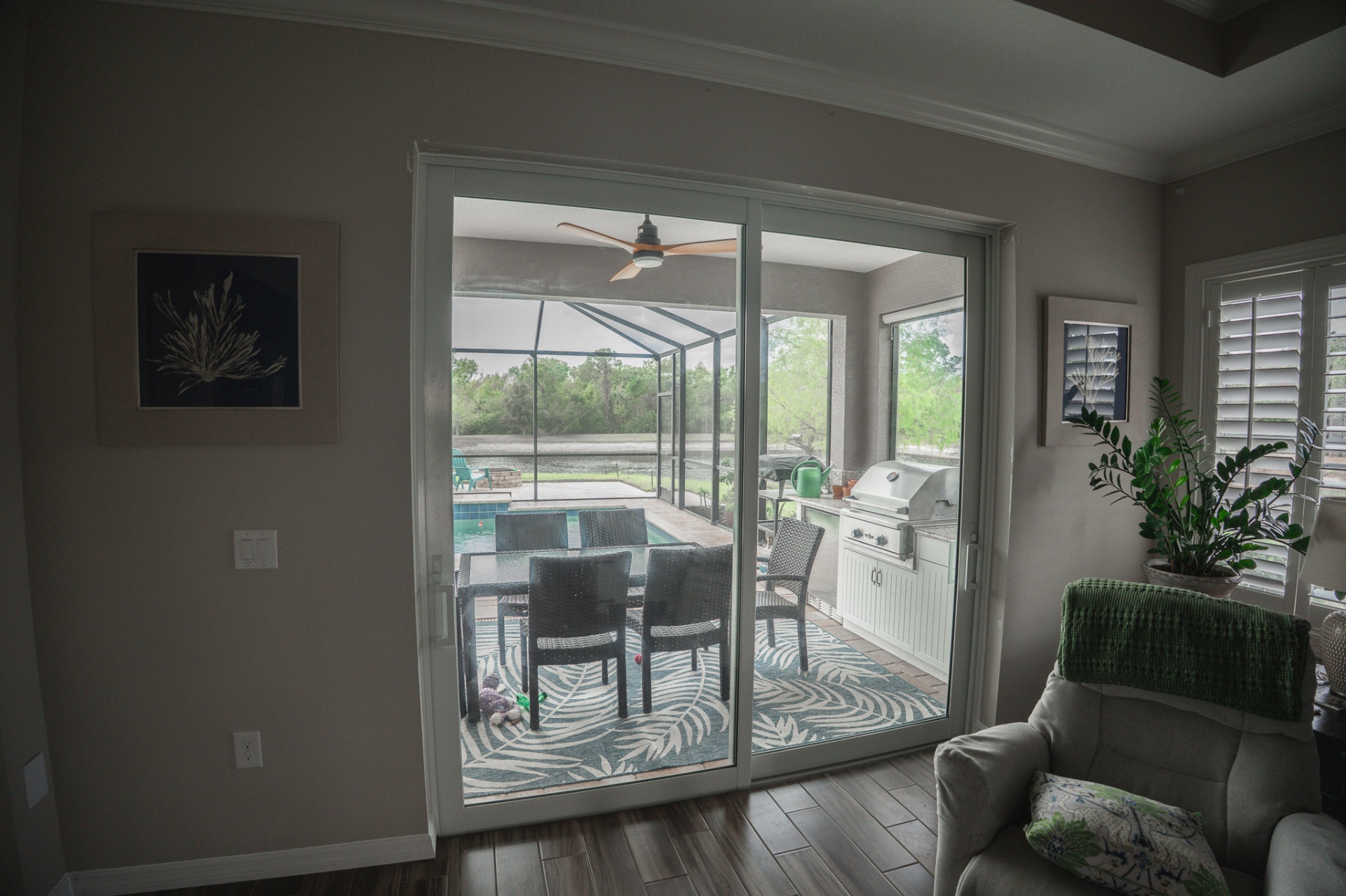 Impact sliding glass doors with pool and lake view