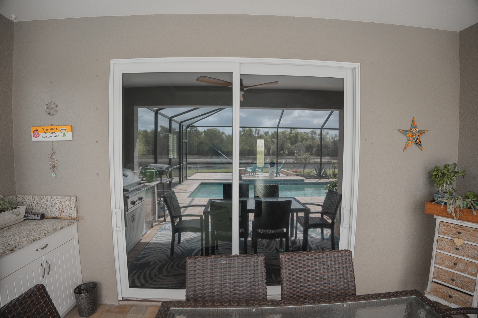 Pocketing impact sliders opening to pool and patio