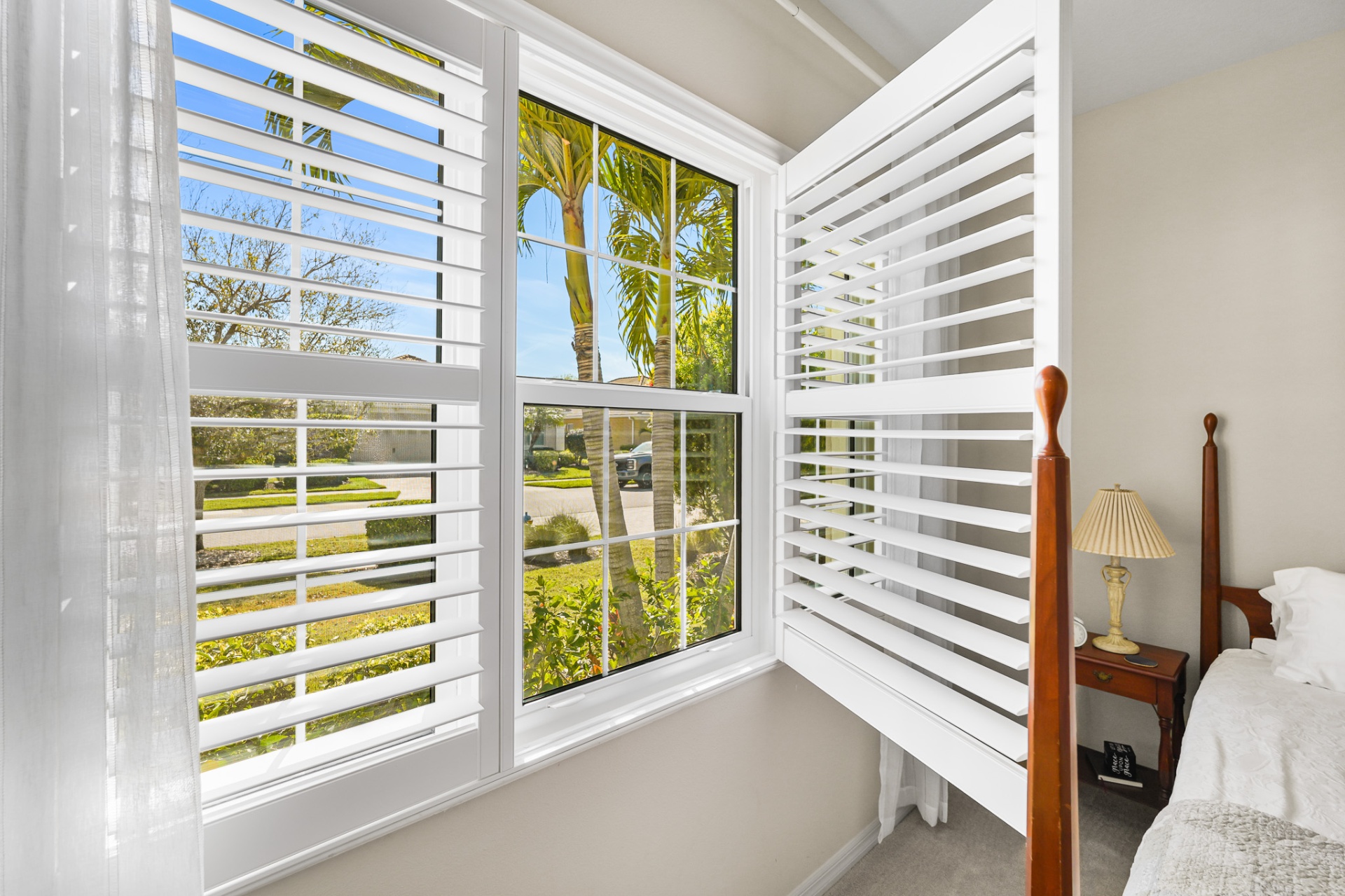 Impact-rated bedroom windows with plantation shutters