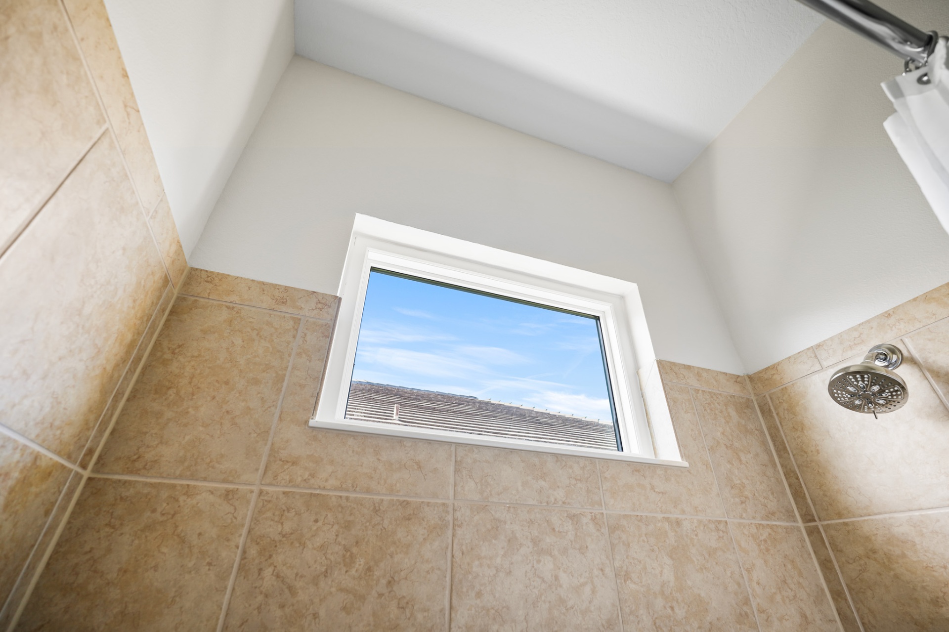 Impact bathroom window above tiled shower